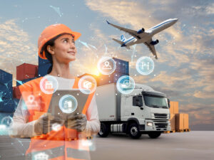 Profissional de logística com caminhão, avião e contêineres ao fundo.